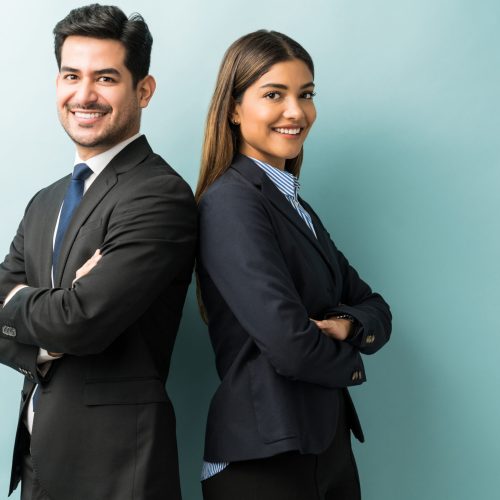 Latin confident professionals in suit standing against isolated background